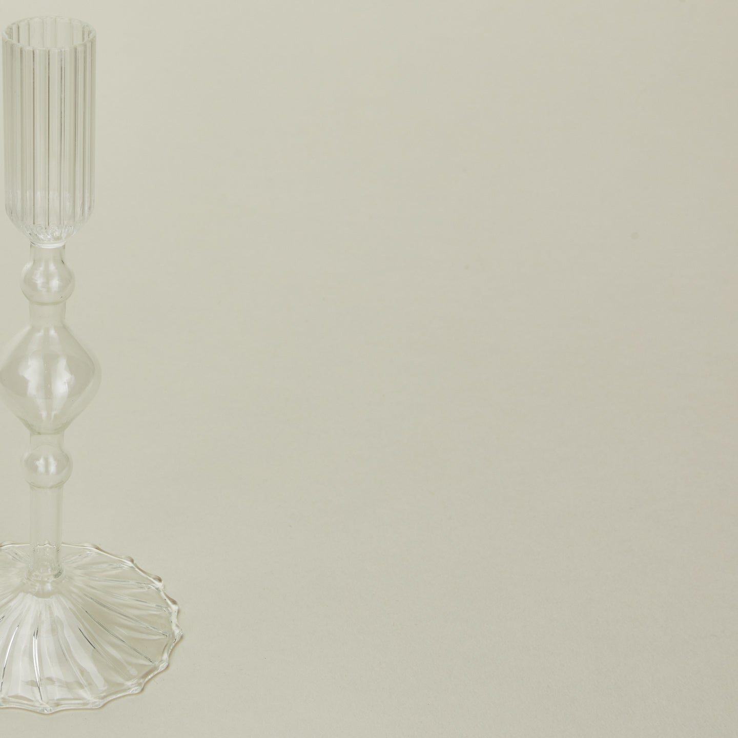 Close up view of Pleated candle holder 
in clear