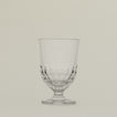 Close up of an Artois water glass.