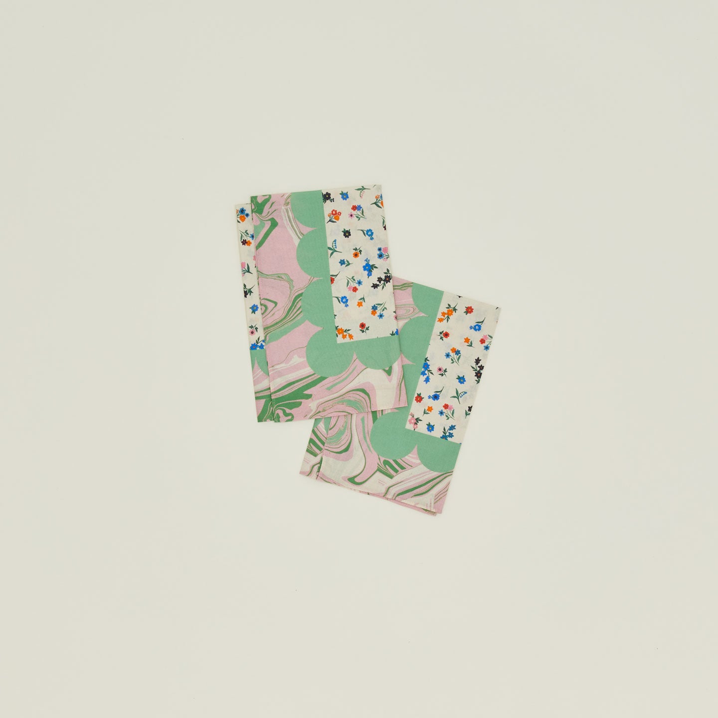 A set of two mixed floral napkins in a peony pattern. 