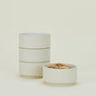 Four Modernist Cereal Bowls, filled with peanuts.