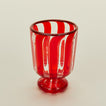 Close up view of red striped wine glass