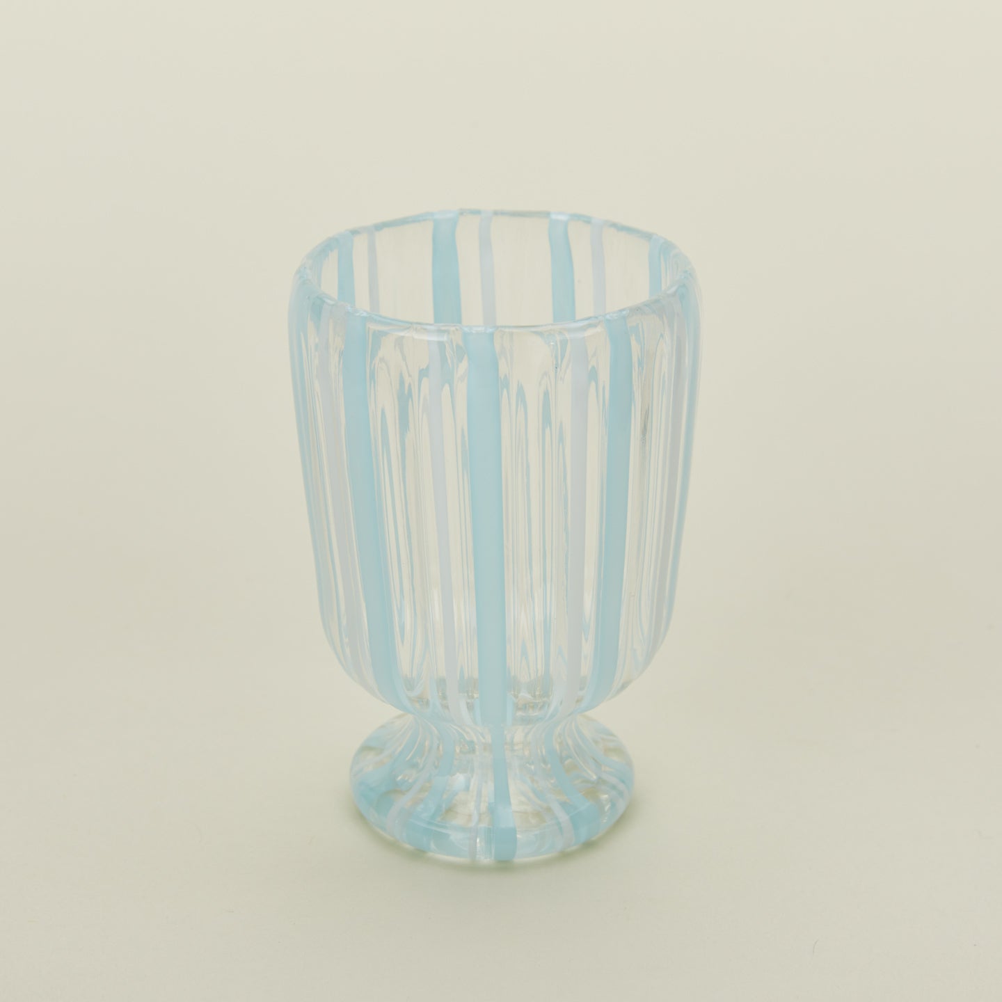Close up view of white  striped wine glass