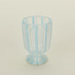 Close up view of white  striped wine glass
