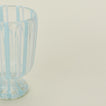 Close up view of white striped wine glass