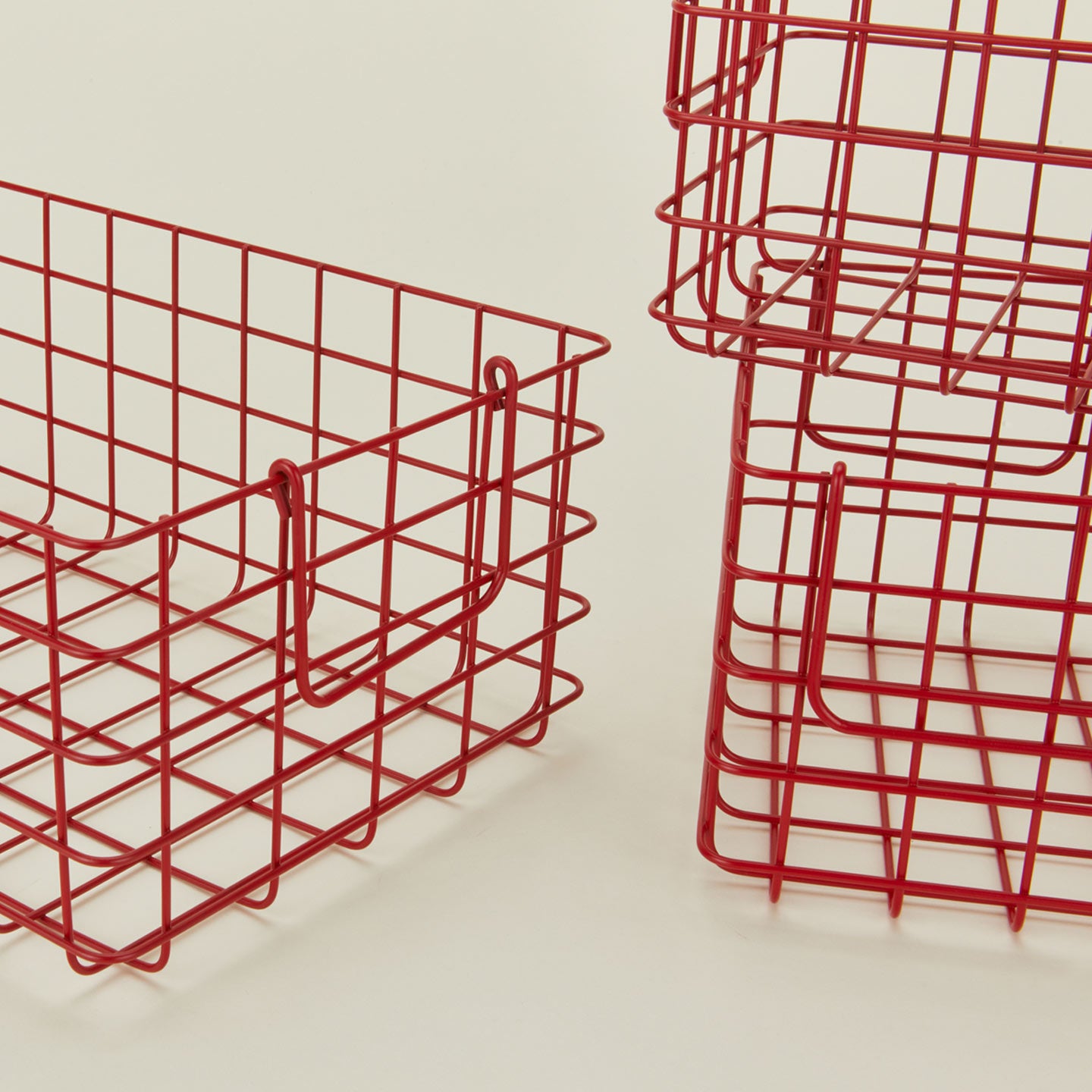Close up view of Set of 3 grid baskets in poppy