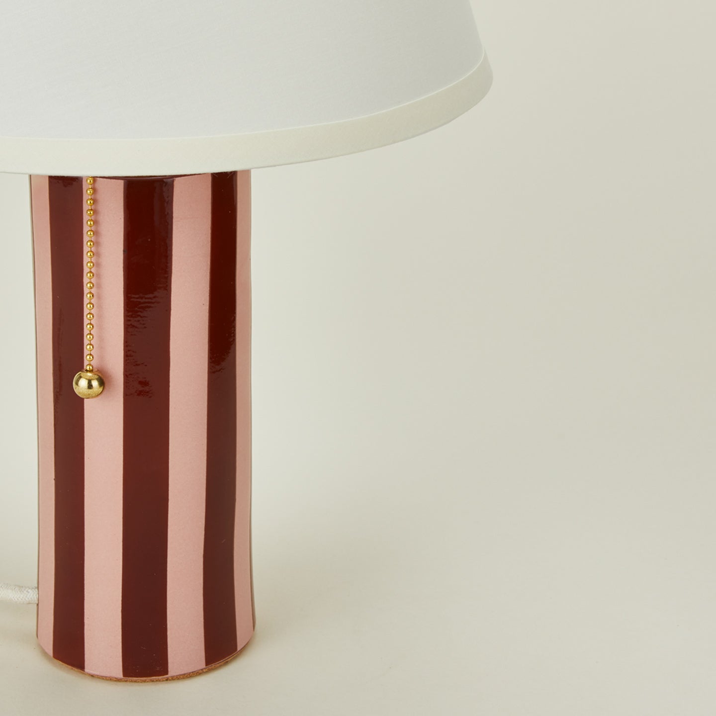 Close up view of Pigeontoe colorstory lamp in blush and terracotta
