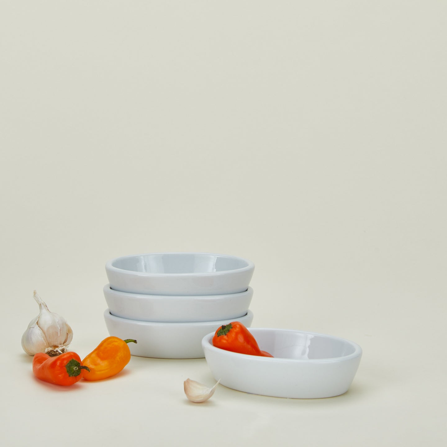 Oval deep oval baker set of 4 with garlic and peppers