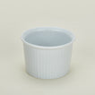 Detailed view of deep porcelain ramekin in white