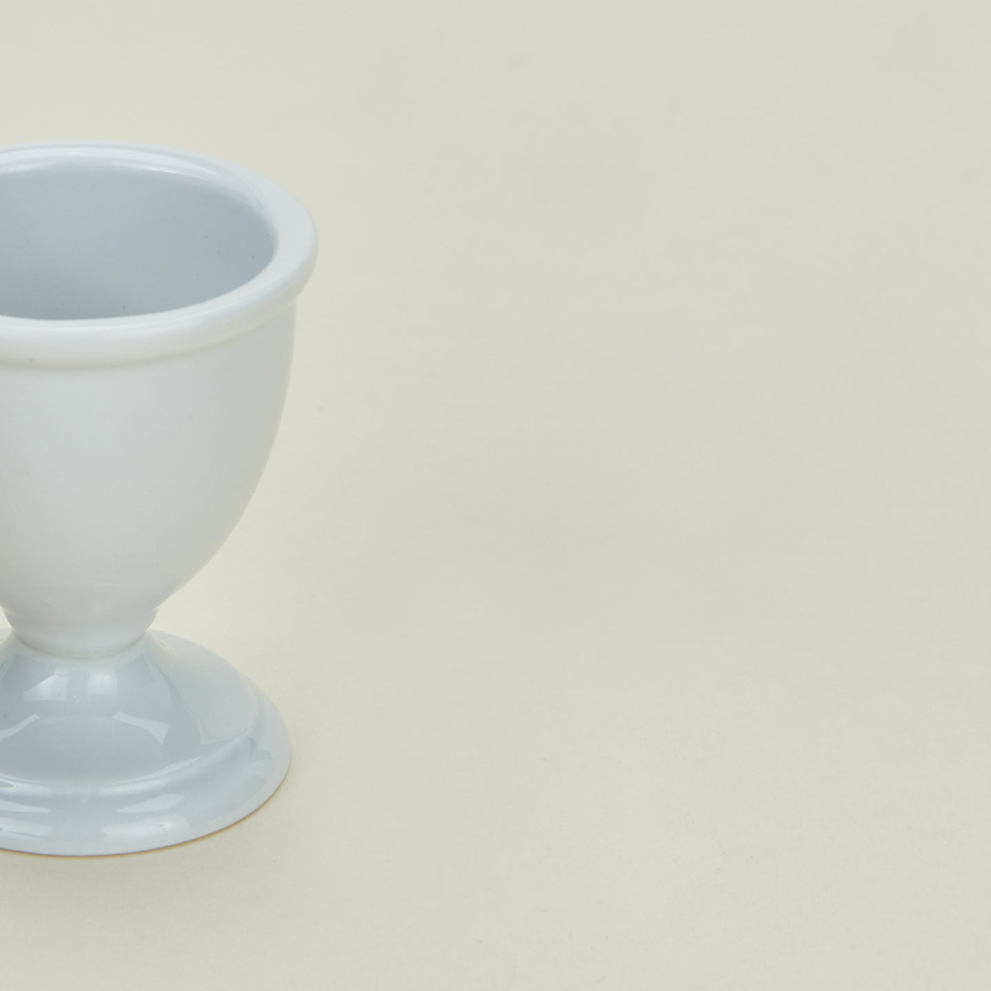 Detailed view of traditional porcelain egg cup in white
