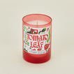 Candle with a red glass container and 'Tomato Leaf' label on a beige background