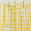 Sun grid shower curtain in butter