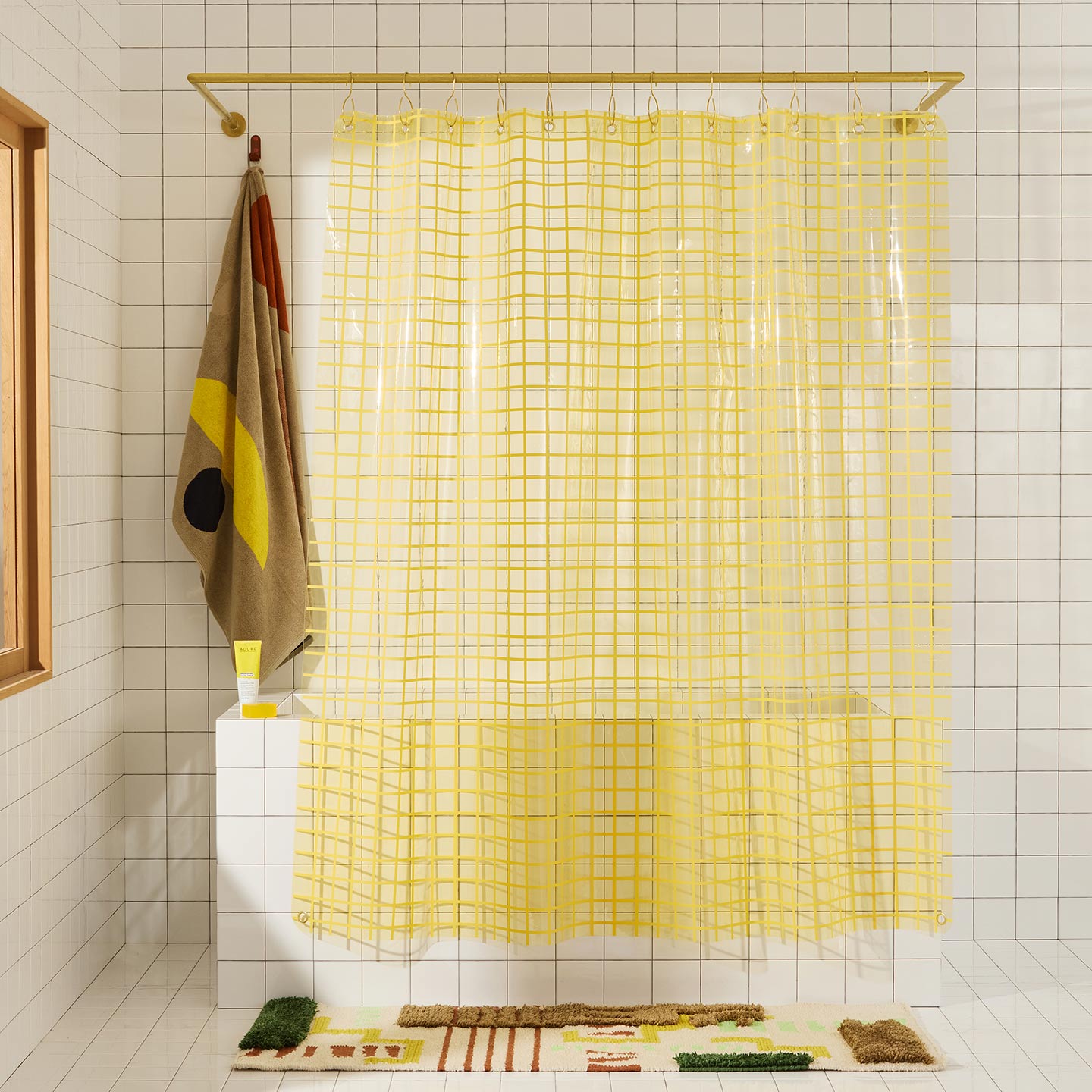 Sun grid shower curtain in butter in bathroom