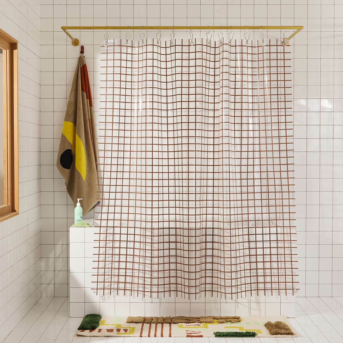 Sun grid shower curtain in honey in bathroom