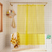 Sunny shower curtain in sun in bathroom