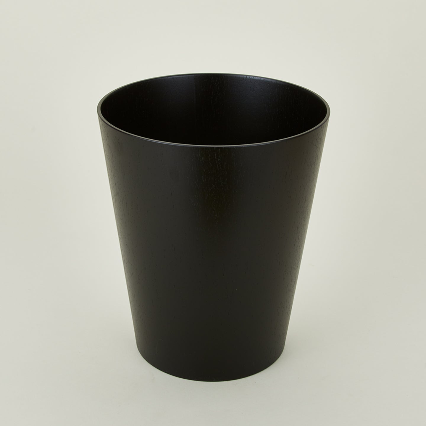 Wooden waste basket in dark