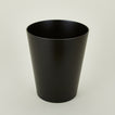 Wooden waste basket in dark