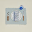 Little flowers napkin in blue with place setting