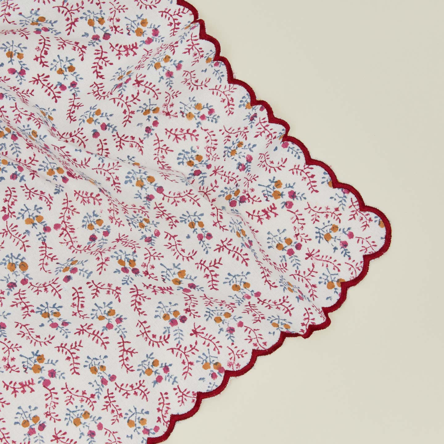 Close up view of little flowers napkin in maroon