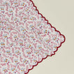 Close up view of little flowers napkin in maroon