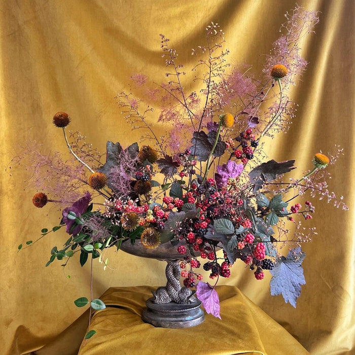 A collage of five floral arrangements featuring various colorful flowers, displayed against different textured backdrops.