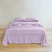 Simple linen bedding in lilac