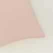 Close up view of simple linen pillow in blush
