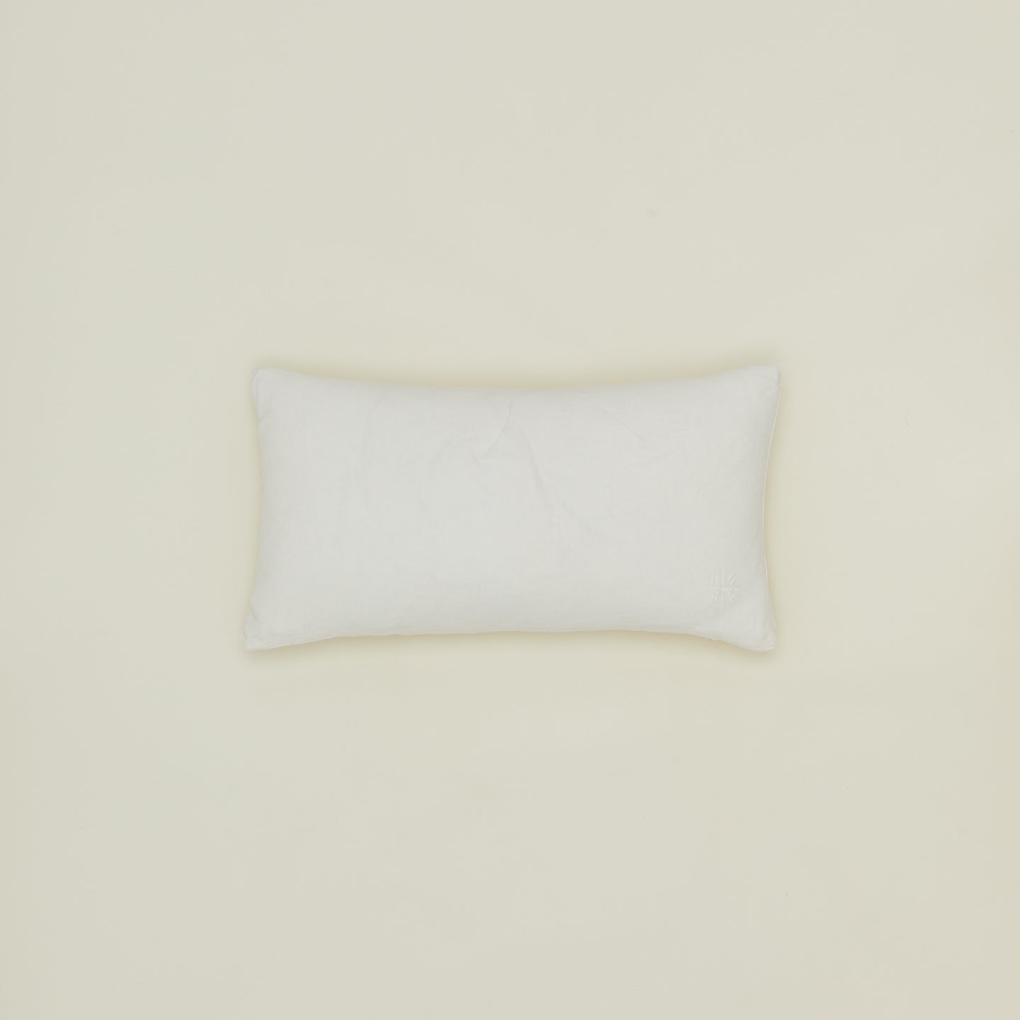 Simple linen pillow in ivory