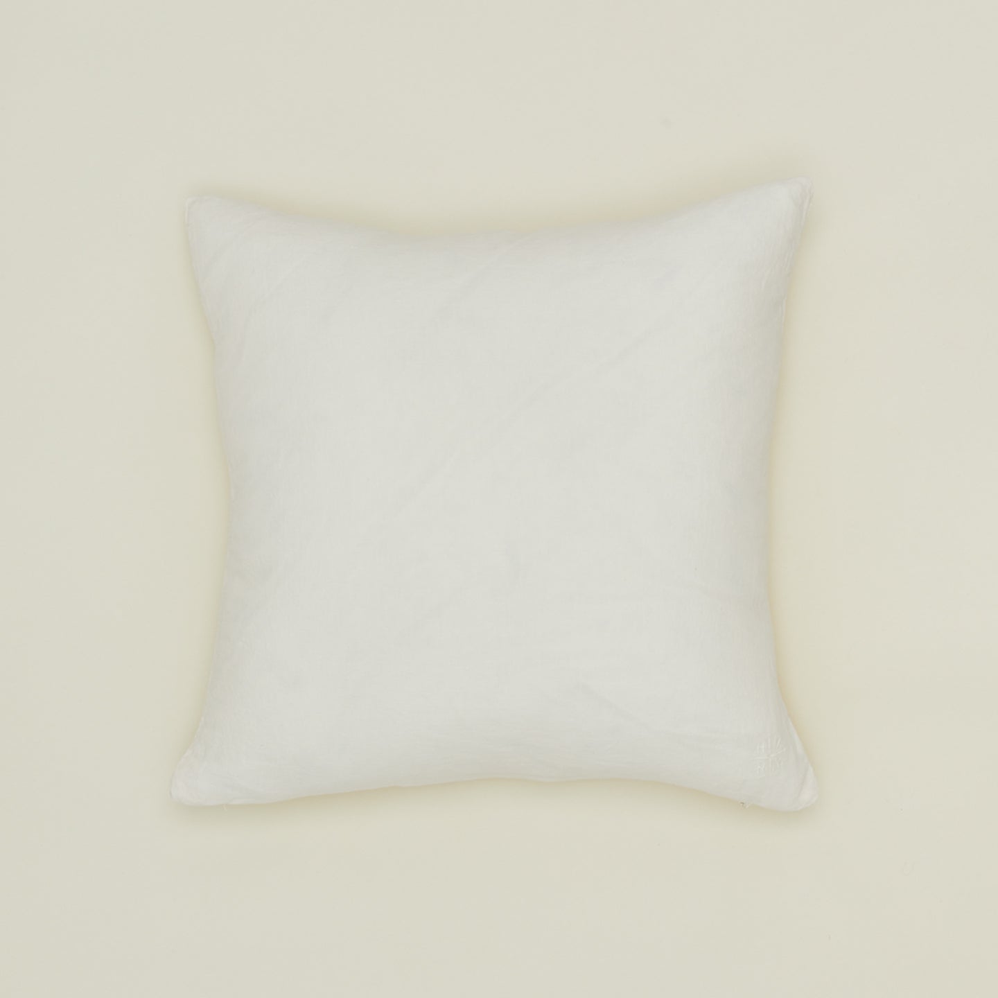 Simple linen pillow in ivory