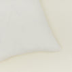 Close up view of simple linen pillow in ivory