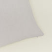 Close up of view of simple linen pillow in light grey