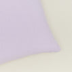 Close up view of simple linen pillow in lilac