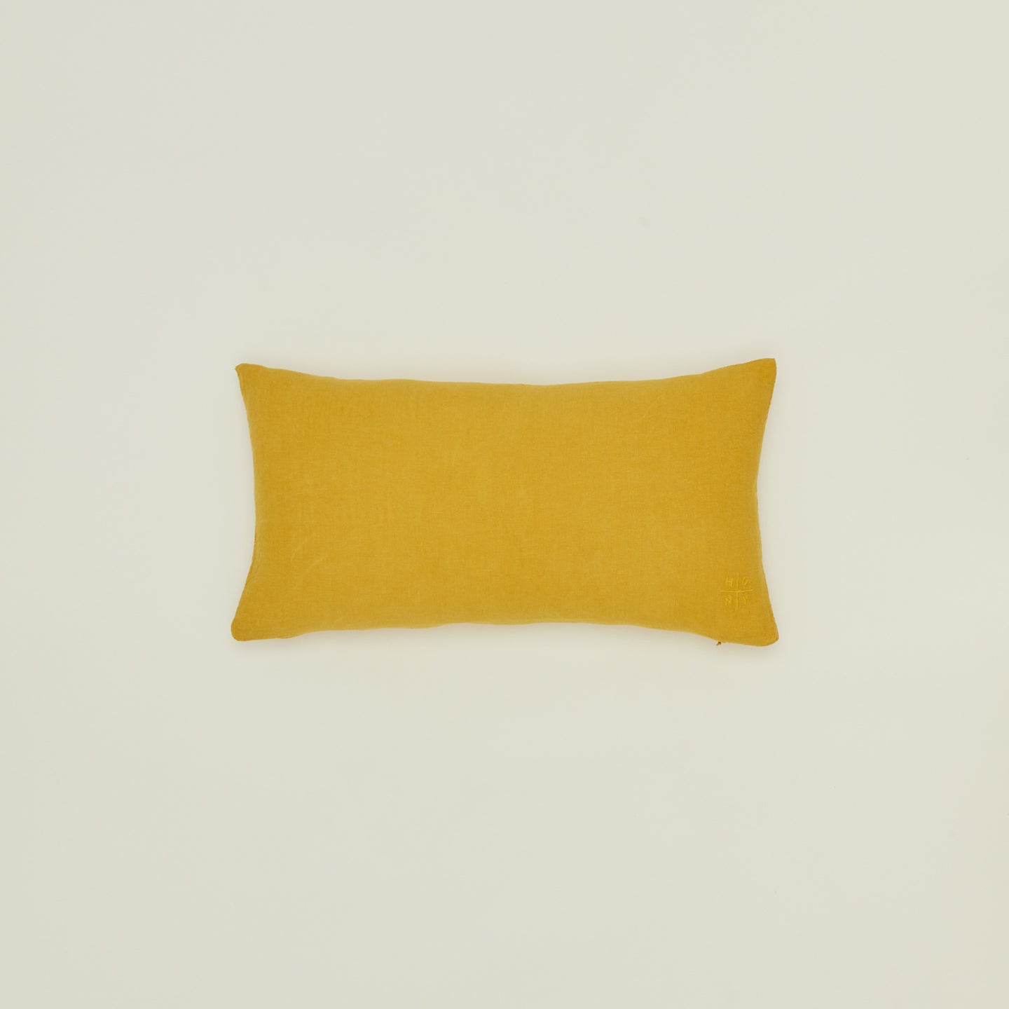 Simple linen pillow in mustard