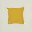 Simple linen pillow in mustard