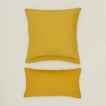 Simple linen pillow in mustard