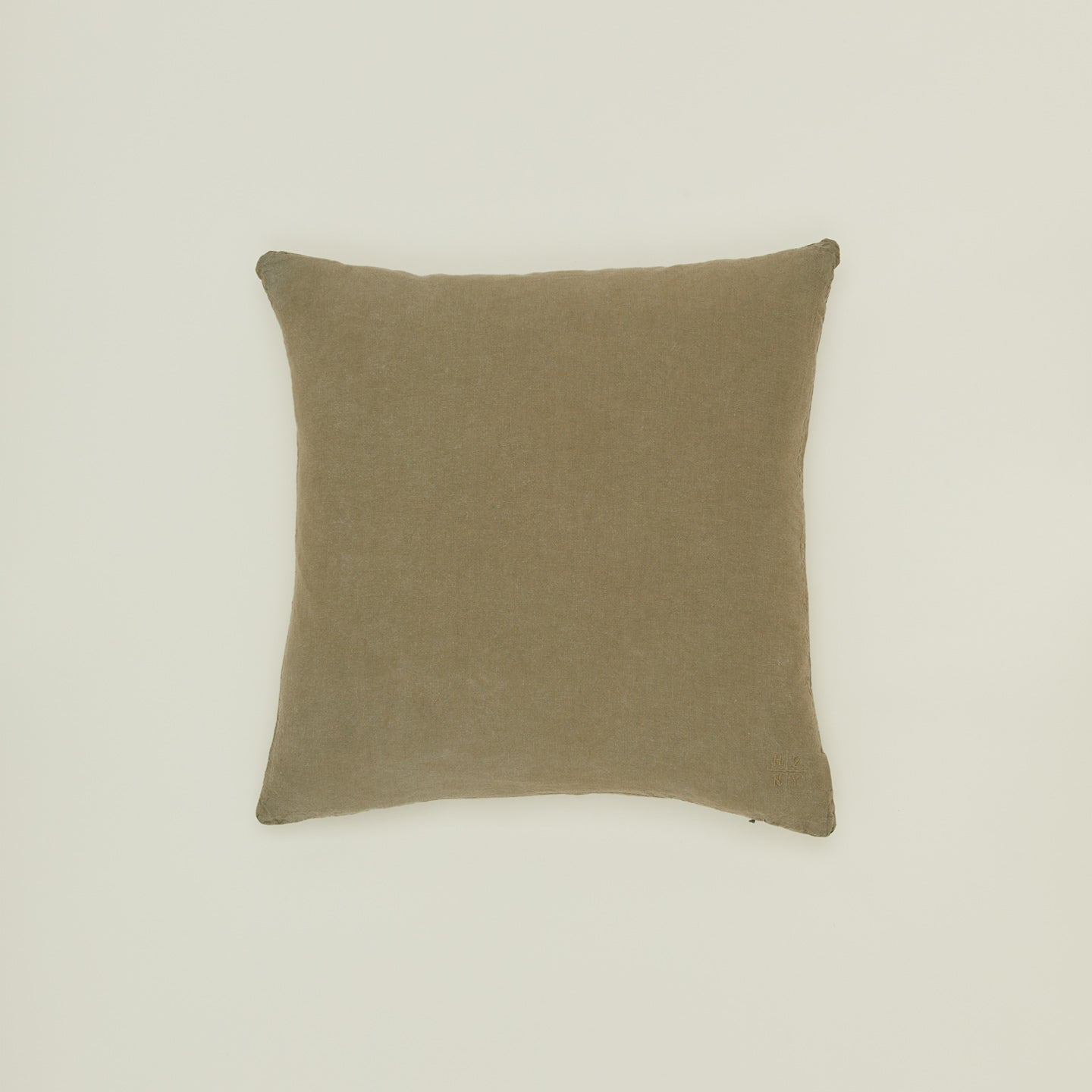 Simple linen pillow in olive