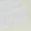 Detailed view of simple linen napkin in white