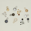 Simple measuring cups and spoons in various finishes