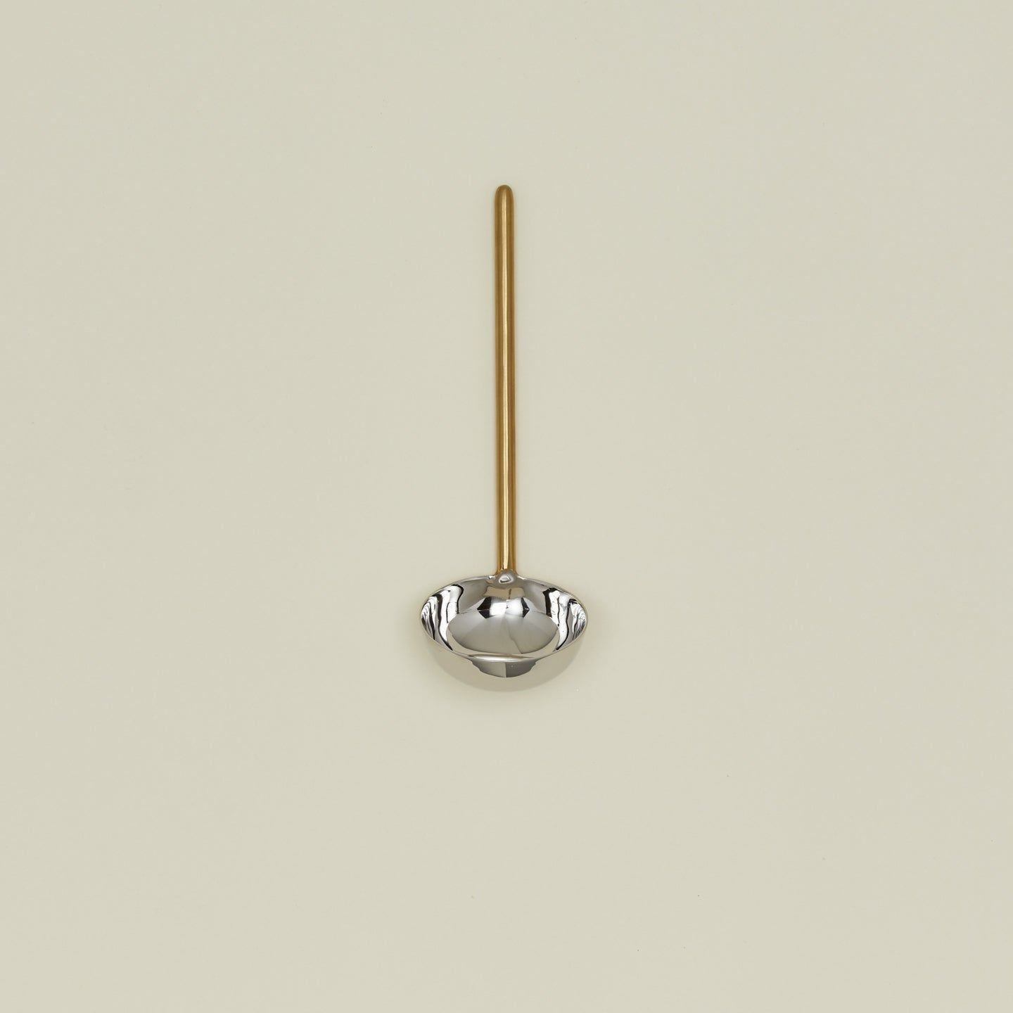 Simple metal ladle in brass