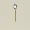 Simple metal slotted spoon in brass