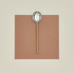 Simple metal slotted spoon in brass