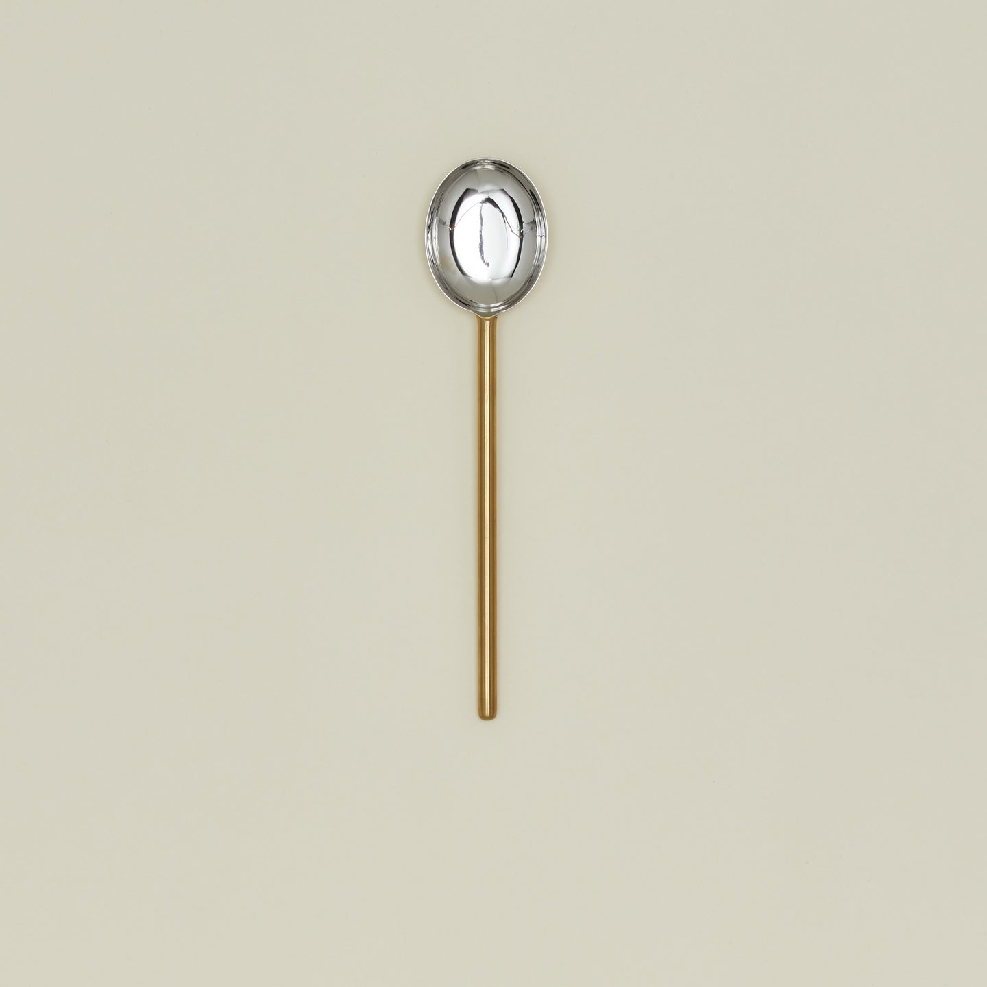 Simple metal spoon in brass