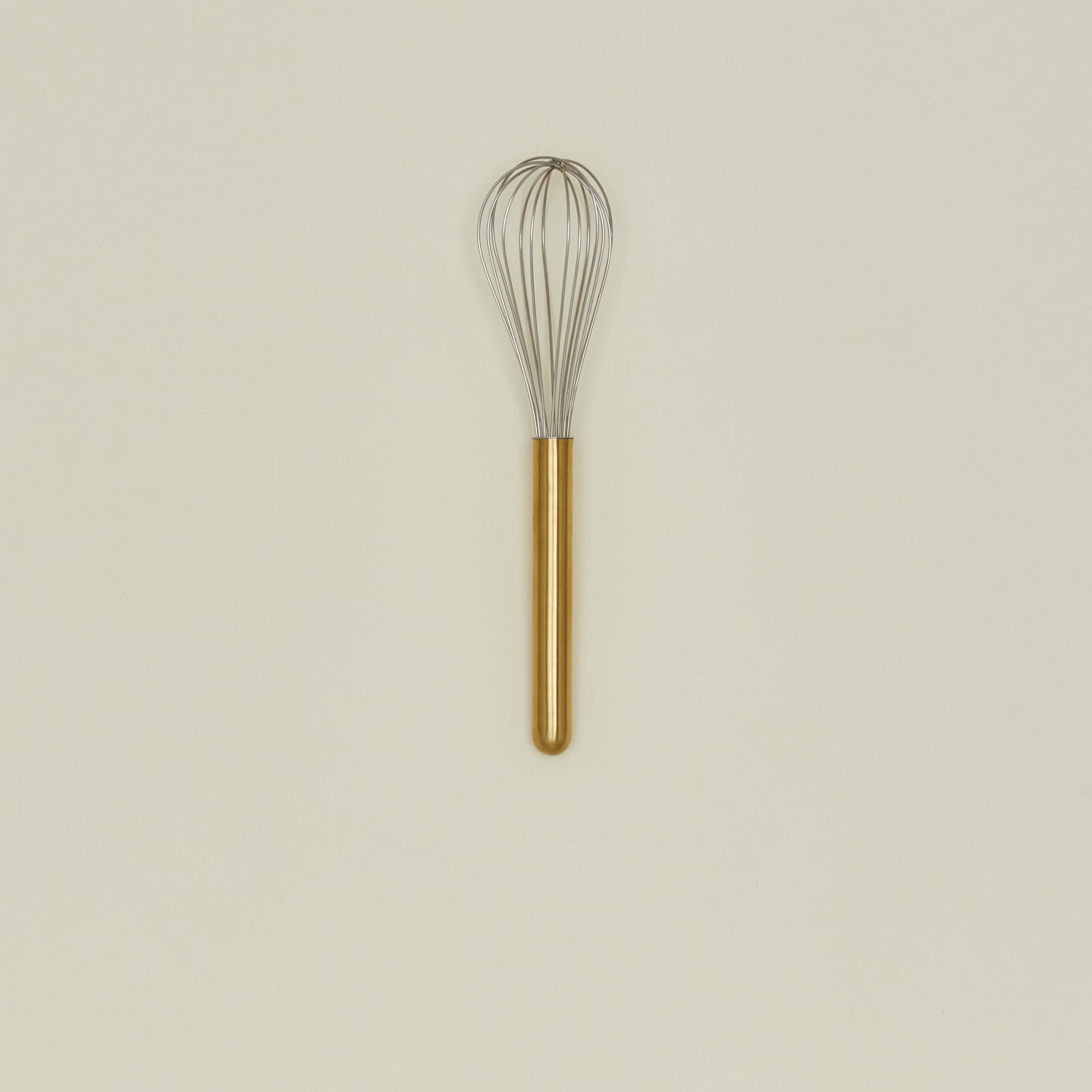 Simple metal whisk in brass