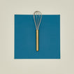 Simple metal whisk in brass