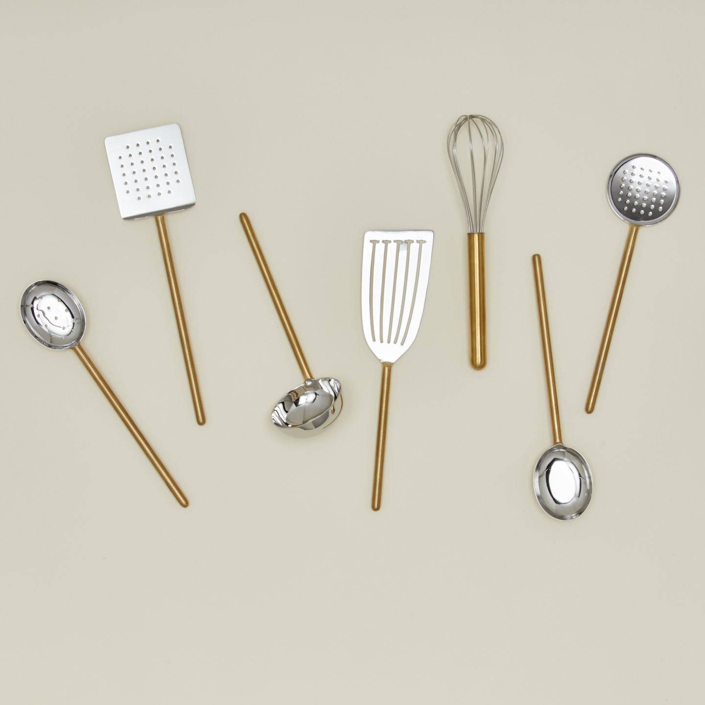 Simple metal kitchen utensil set in brass