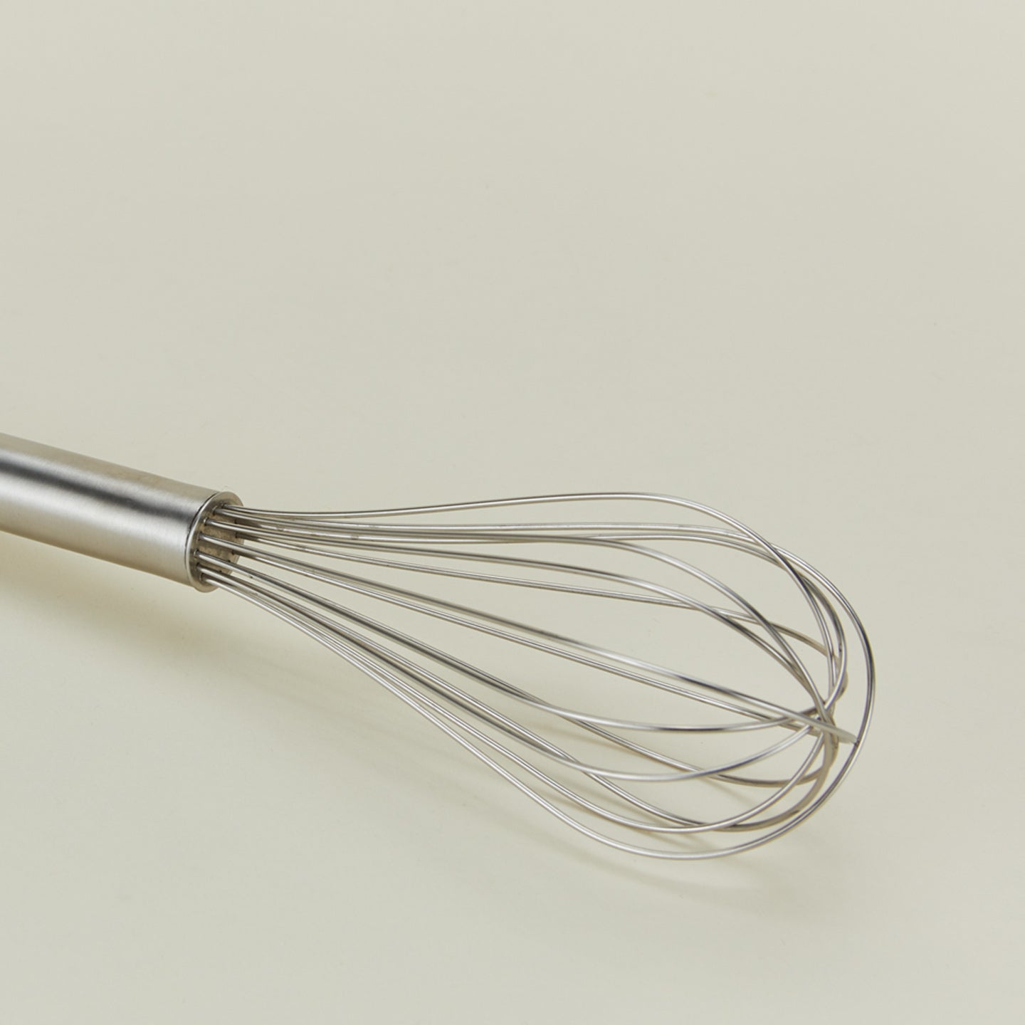 Close up view of Simple metal whisk in silver