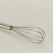 Close up view of Simple metal whisk in silver