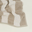 Close up of Simple Striped Terry Bath Mat in ivory and flax.