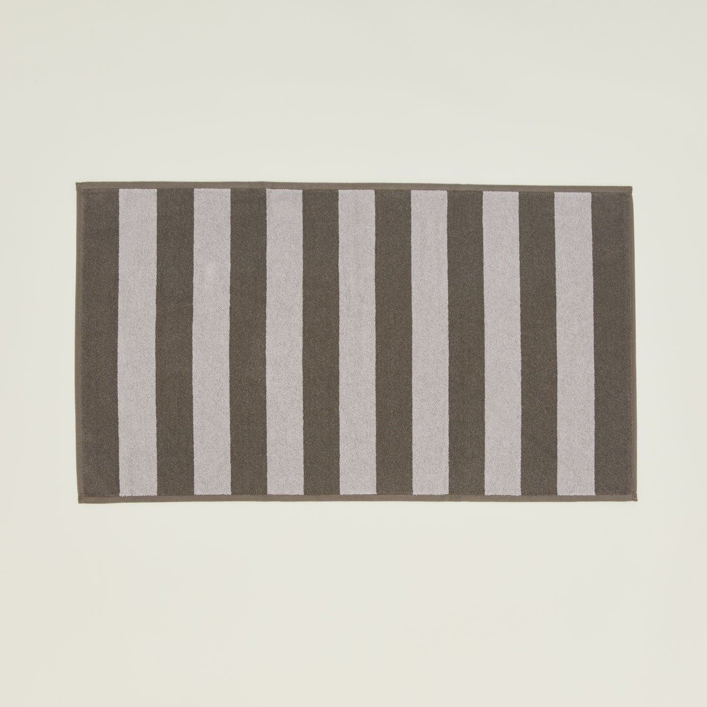 Simple Striped Terry Bath Mat in light grey and dark grey.