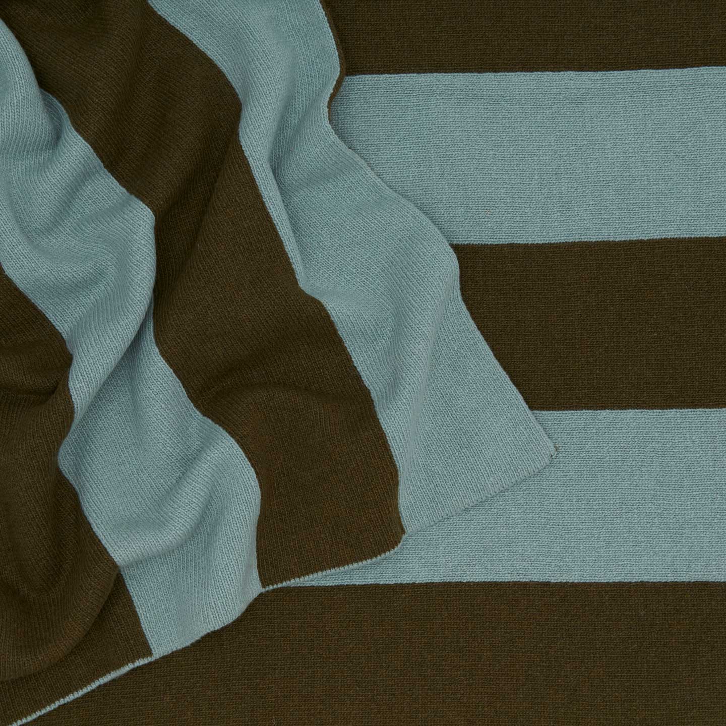 Striped throw in olive and sage close up 
