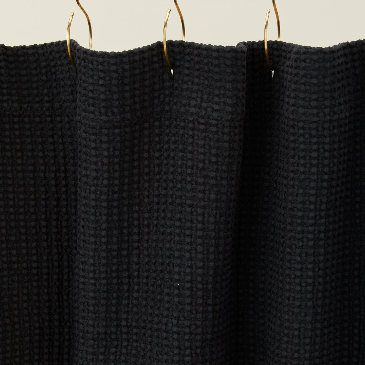 Simple waffle shower curtain in black